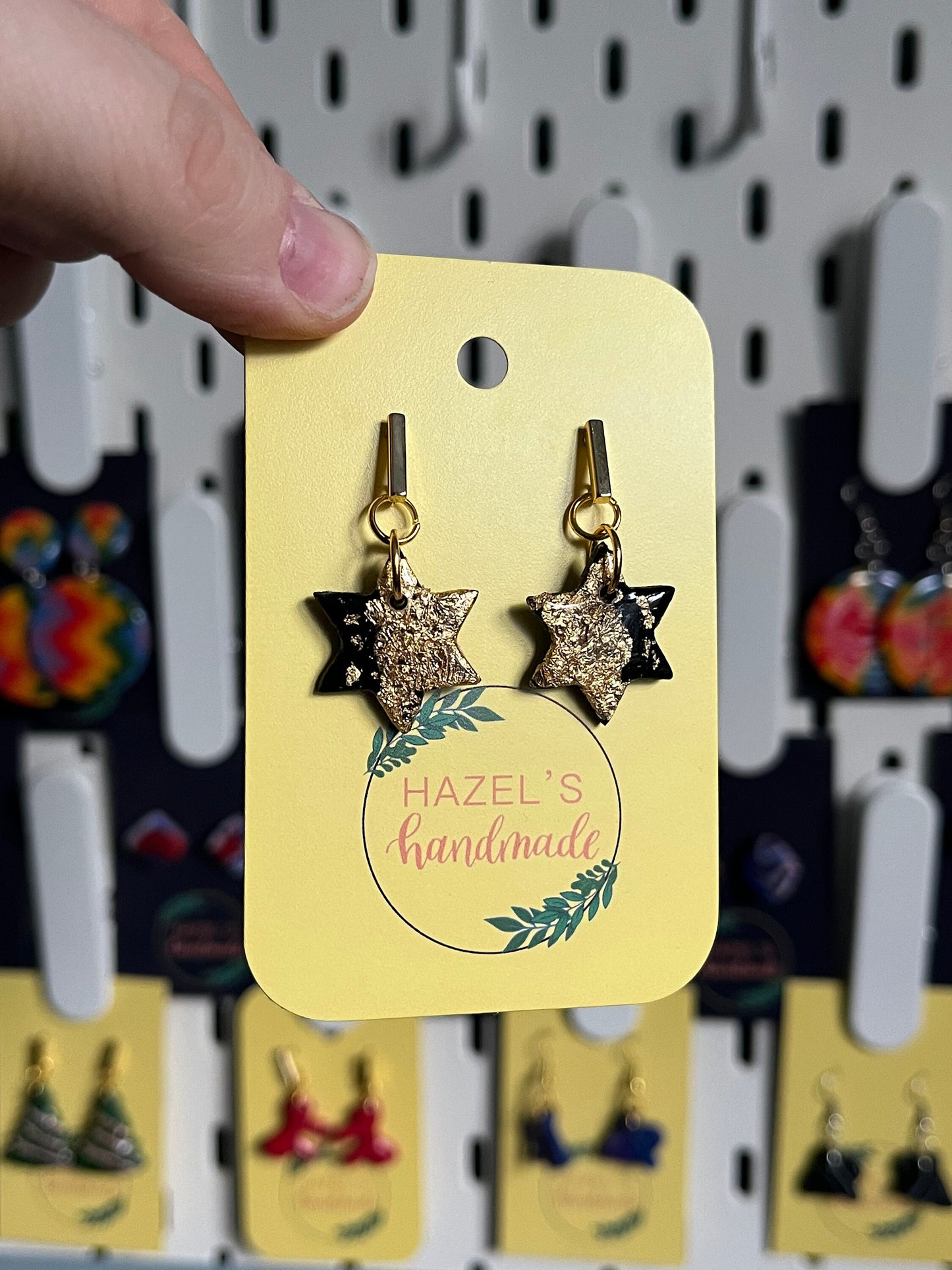 Black and Gold Star shaped Drop Earrings with Gold leaf on