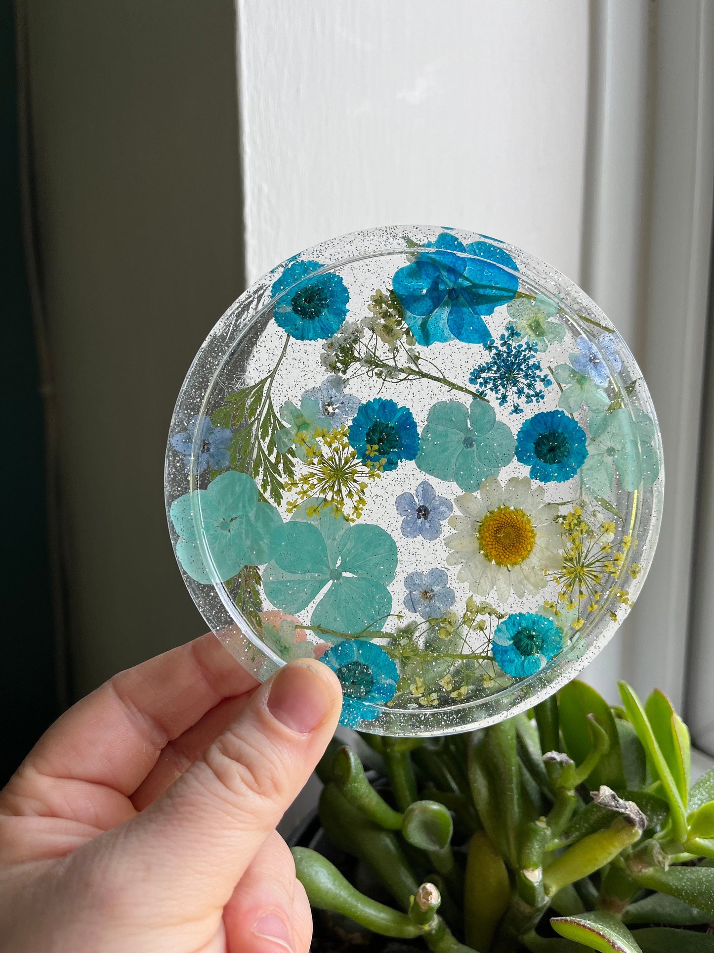 Clear Drinks Coaster with Dried flowers and Glitter with a blue theme