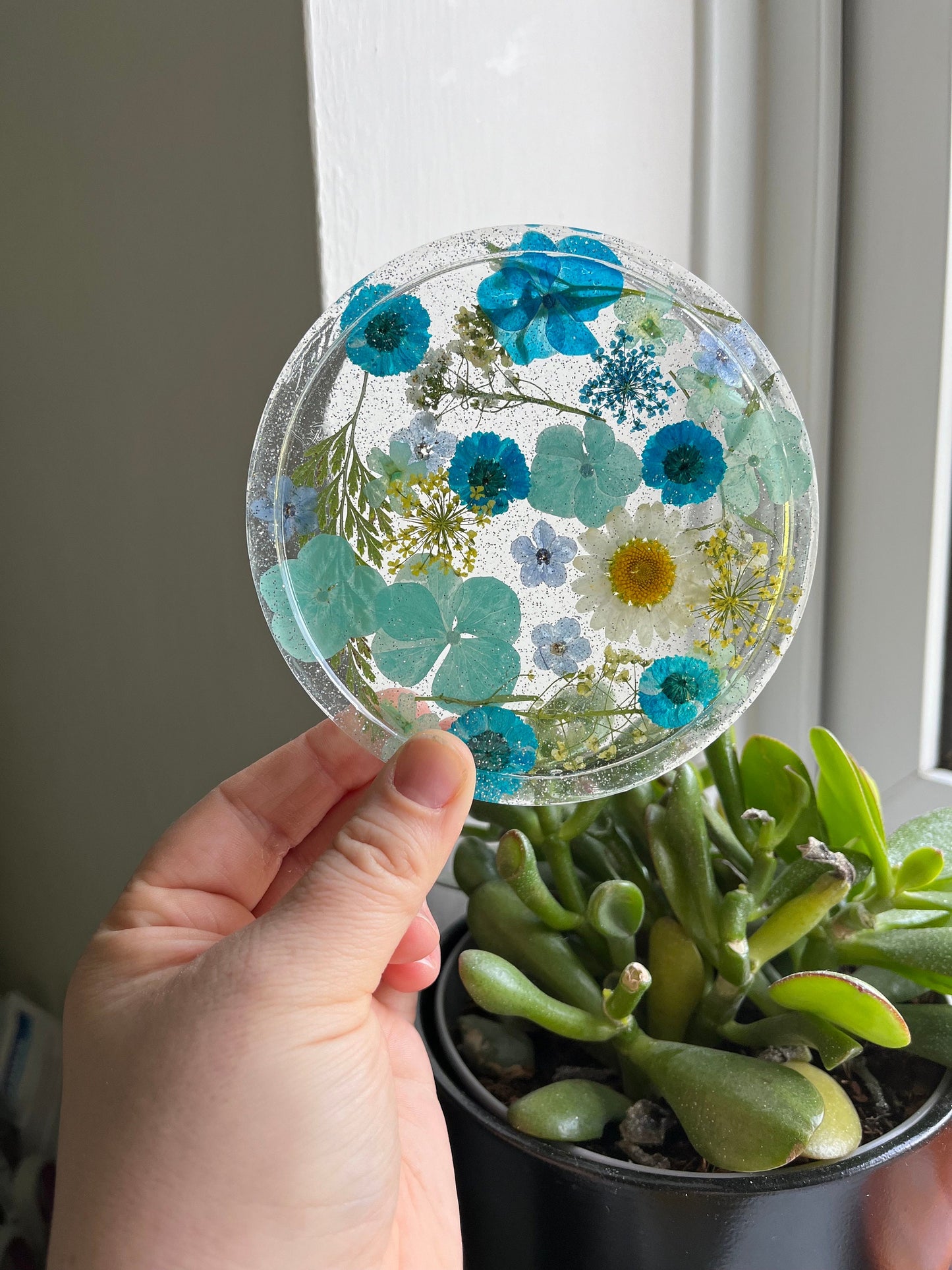 Clear Drinks Coaster with Dried flowers and Glitter with a blue theme